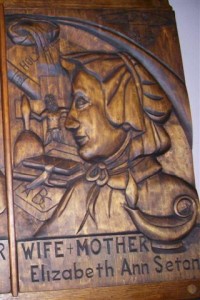 Our Altar of Sacrifice also contains a relic of St. Elizabeth Seton (1774-1821), the first saint born in the U.S. to be canonized. This woodcarving hangs on the left (east) transept wall. It is a gift of the Southtowns Wood Carvers of WNY.