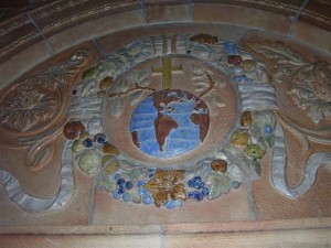 Terra cotta ornamentation in the right (west) transept Shrine Area. The “Globe surmounted by a Cross, Olive Branch and Lily…are used as symbols of Christ’s life on earth.” Rev. Walter Kern’s Guidebook to Blessed Trinity R.C. Church, page 27. Photo credit: Margaret Dick.