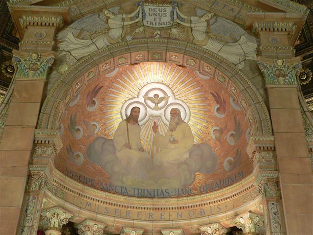Depiction of the Blessed Trinity in our church's baldachino. Photo credit: Gary Kelley