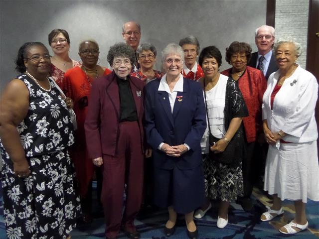 Sr. Claire Edwards, center, joined by parishioners at diocesan tribute to Daughters of Charity.
