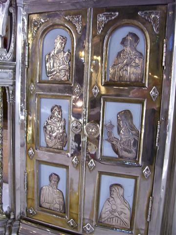 St. John Vianney, whose feast the Church celebrates on August 4, is one of six saints associated with the Eucharist or the offering of sacrificial gifts who is depicted (bottom left) in silver relief on the doors of our Tabernacle. Photo credit: Margaret Dick