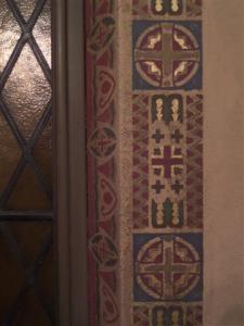 Decorative stenciling surrounds the windows in our Daily Mass Chapel.