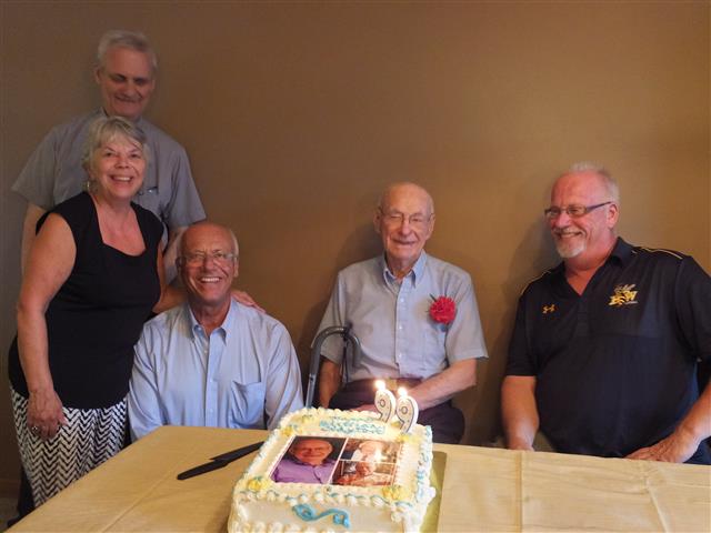 Clate Steinwachs celebrates his 99th birthday with daughter, Ann, and sons David, Tom & Joe.