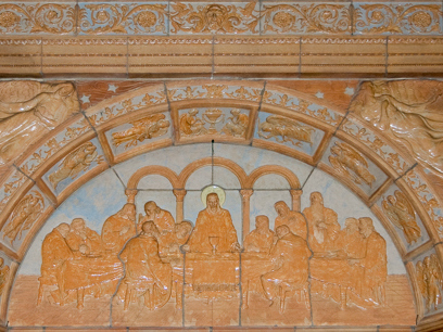 Detail of P. Kuhnle's ceramic relief of the Last Supper over the doorway in the right (west) transept. Photo credit: Steve Mangione